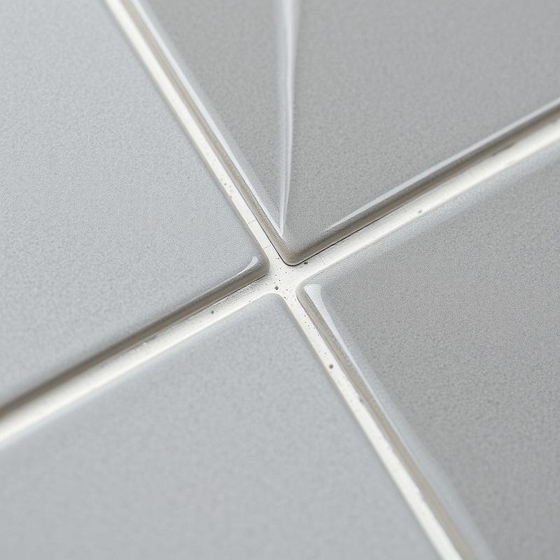 Close-up of epoxy tile grout showing glossy finish in a modern bathroom